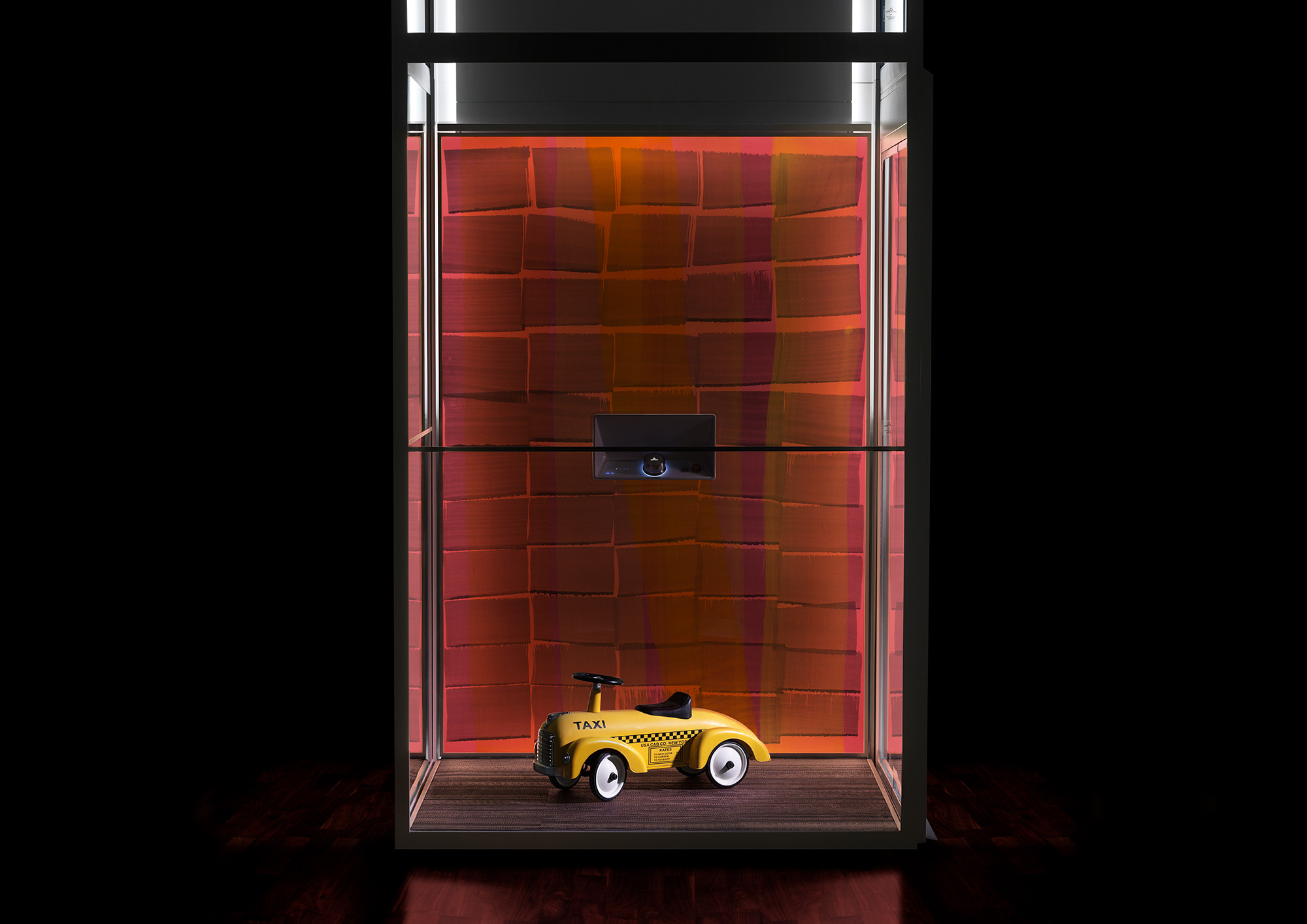 Aritco home lift with a DesignWall in orange