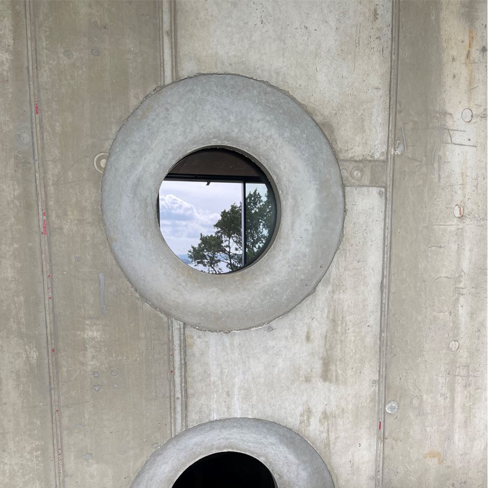 Round holes in cement with a window 