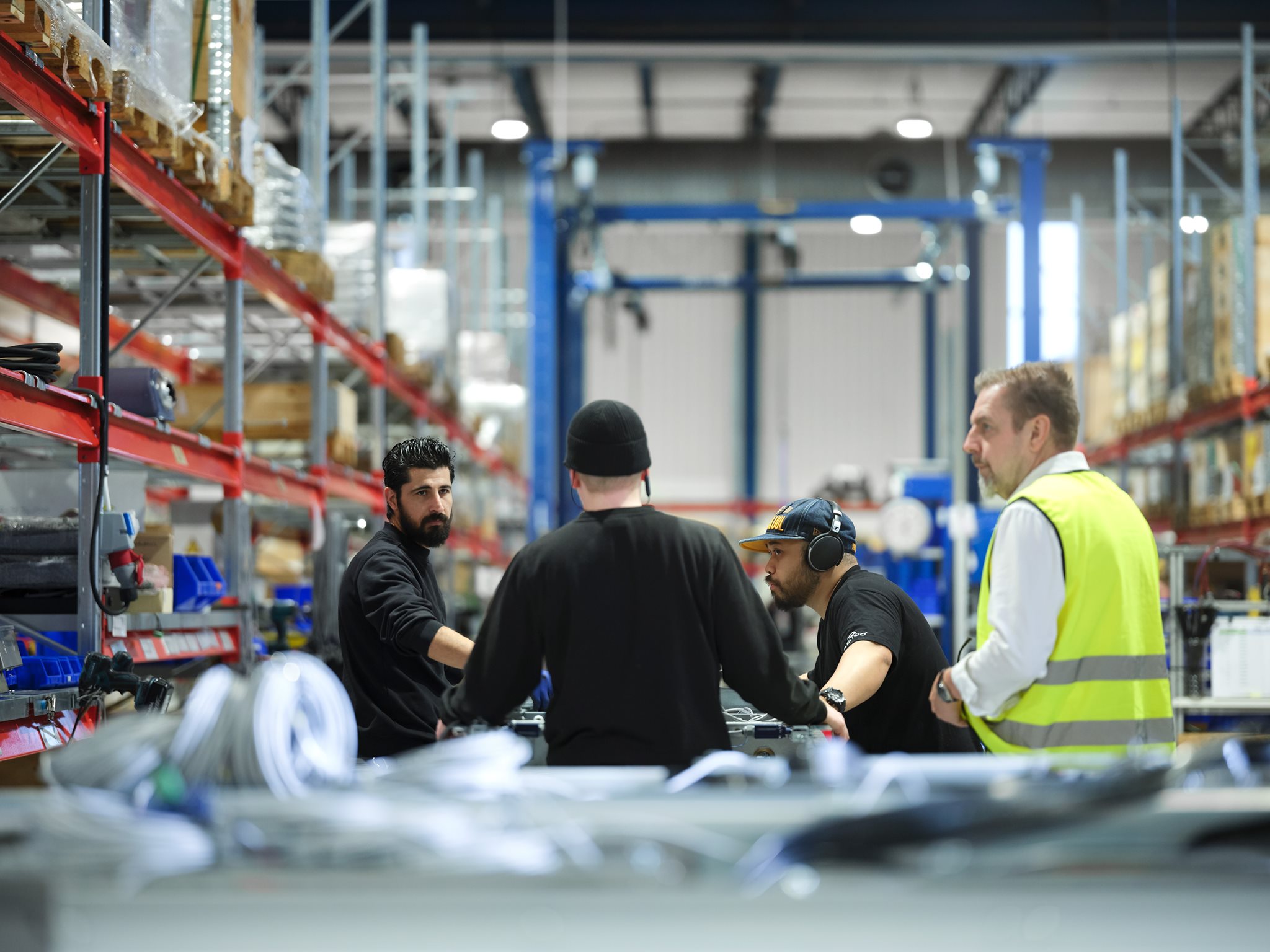 Men working in the production area of Aritco lift