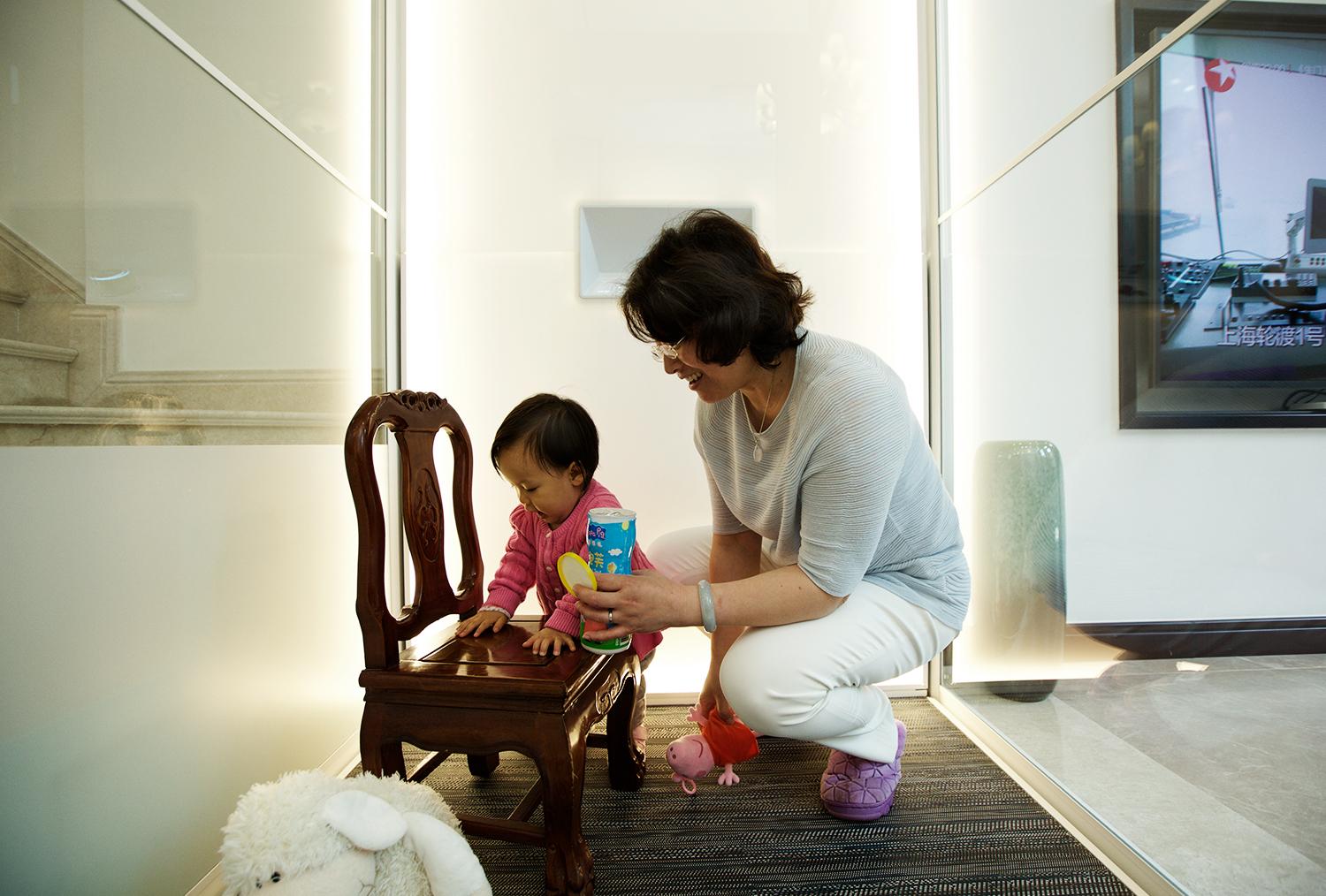 Grandmother and a child in a home lift