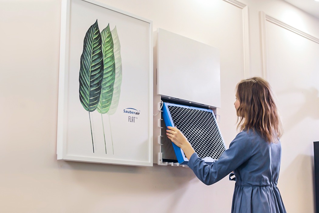 A woman with an air purifier