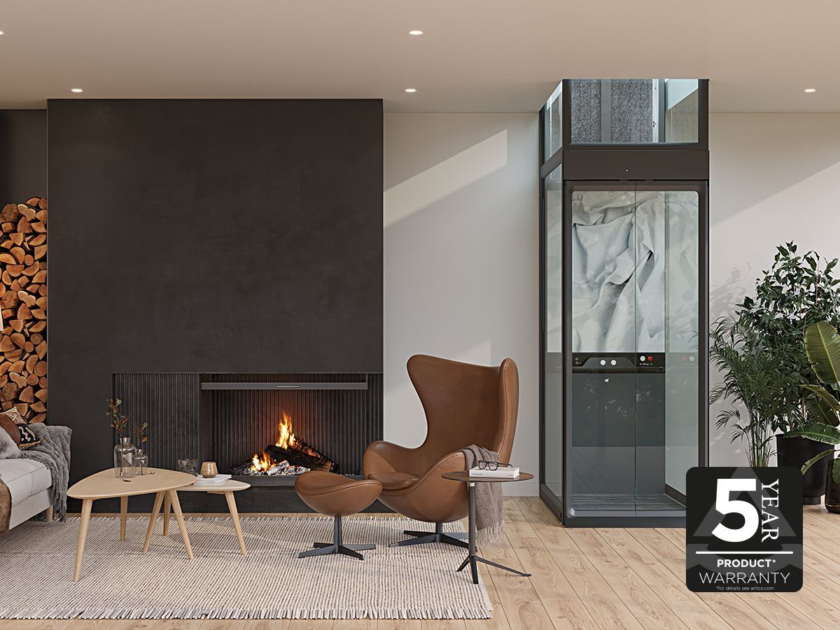 Compact home lift in livingroom with a fire place. An Aritco HomeLift Compact.