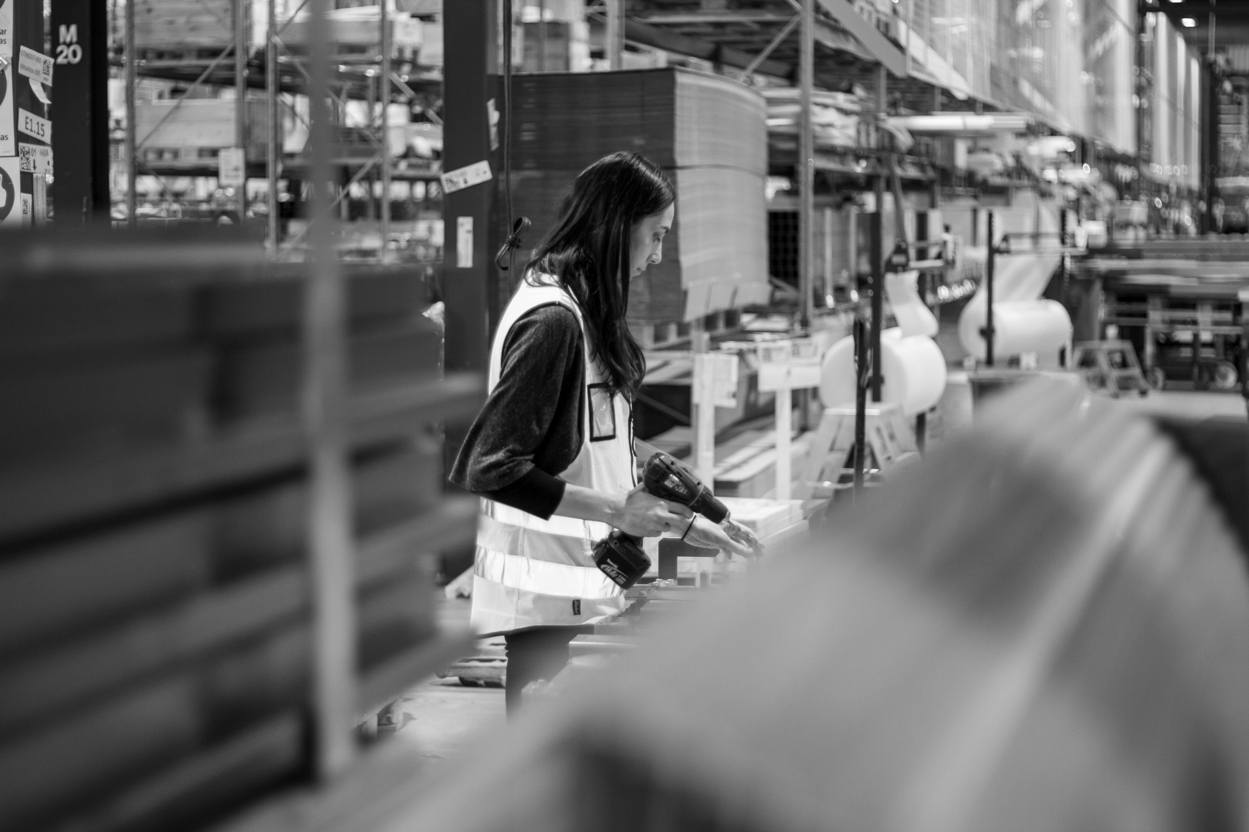A woman working in a production area, black and white