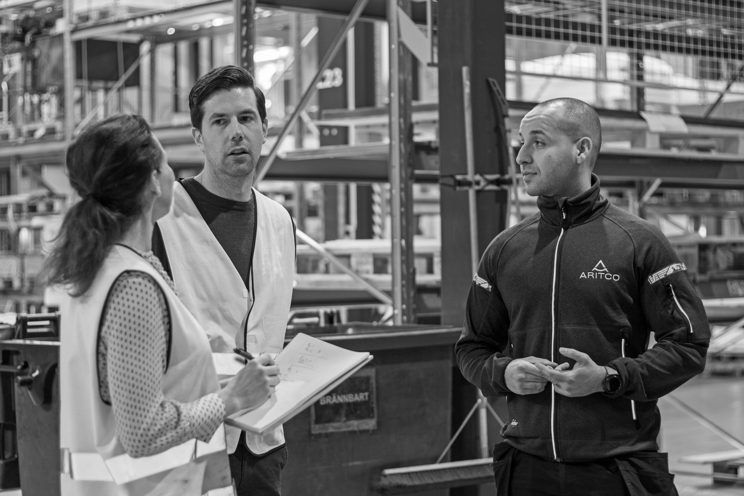 Interview in a production area, bland and white