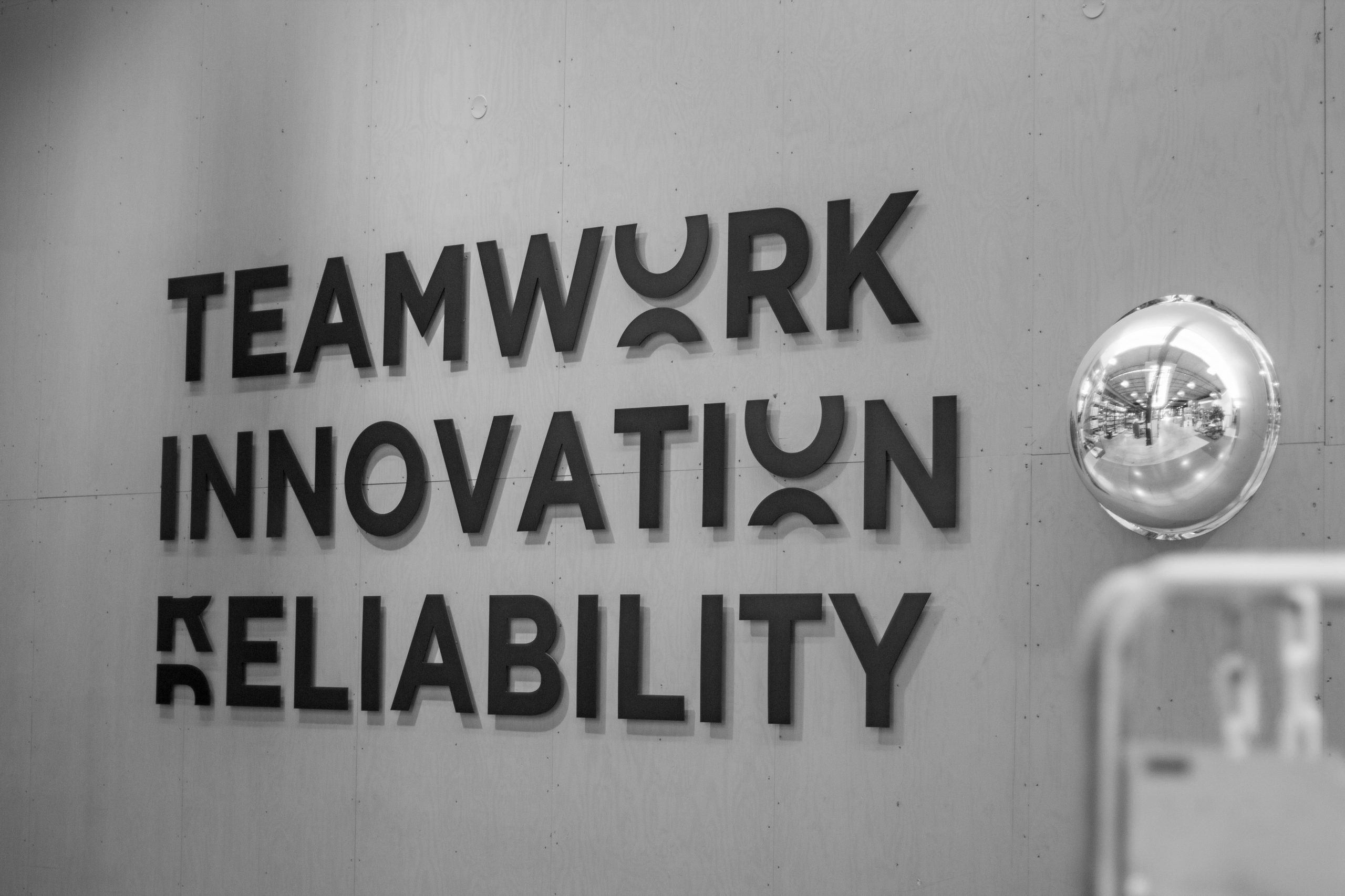 The words Teamwork, innovation, reliability