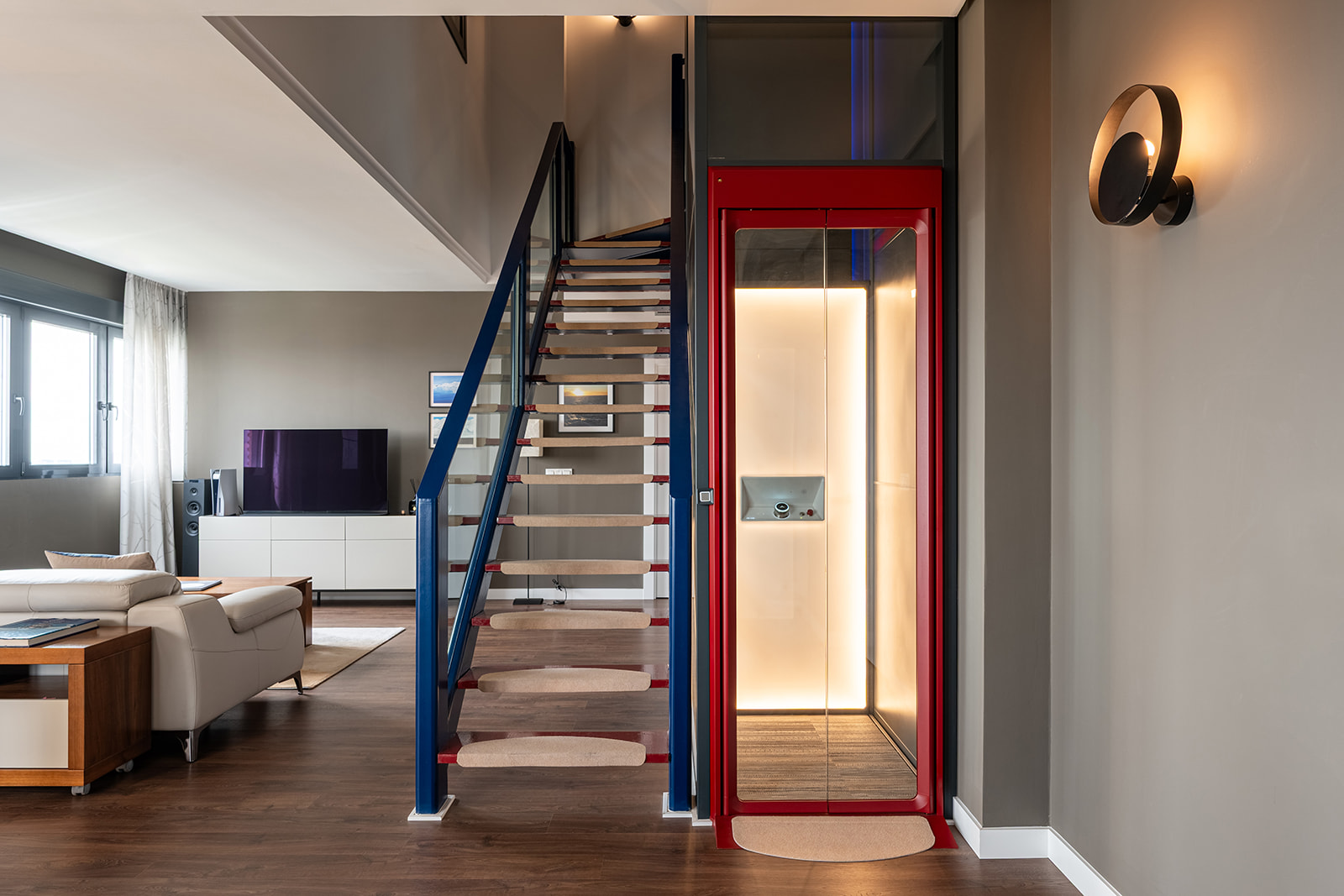 home lift in red installed in penthouse